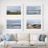 Ghosts of the Harbor fine art photography series by Brice Weaver, four framed harbor photographs from Puerto Natales, Patagonia displayed in a grid above a neutral sofa in a coastal interior